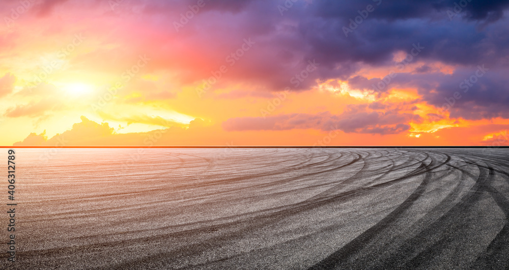 Asphalt race track road and sky clouds at sunset.Road ground background.