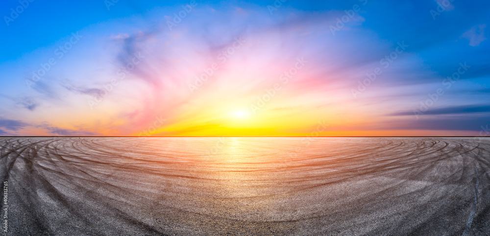 Asphalt race track road and sky clouds at sunset.Road ground background.