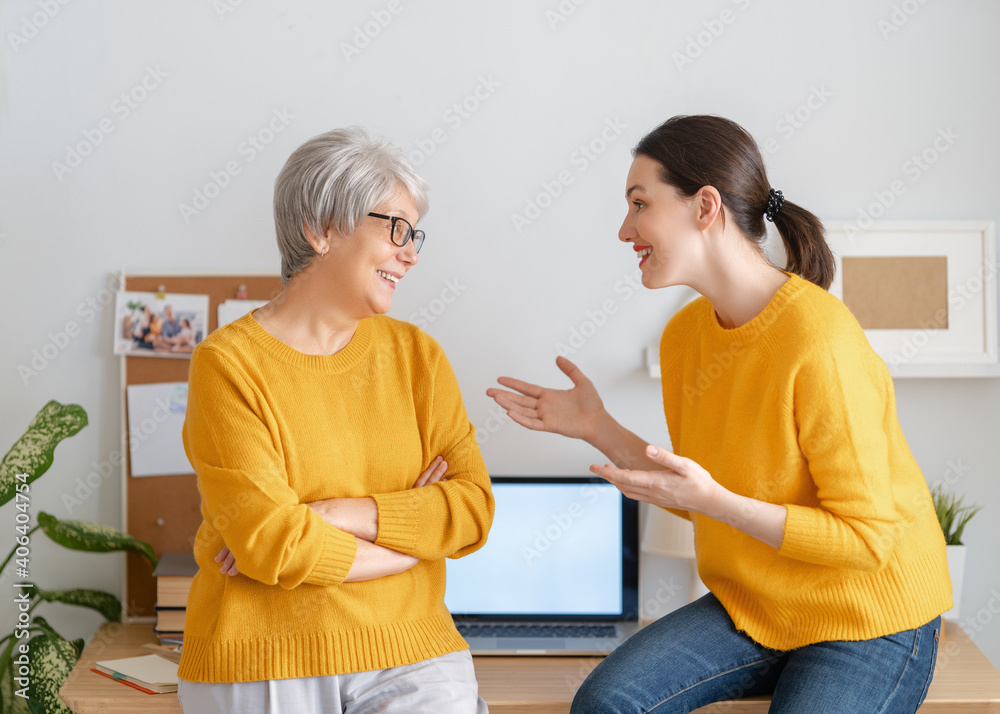 women are chatting and laughing in the office