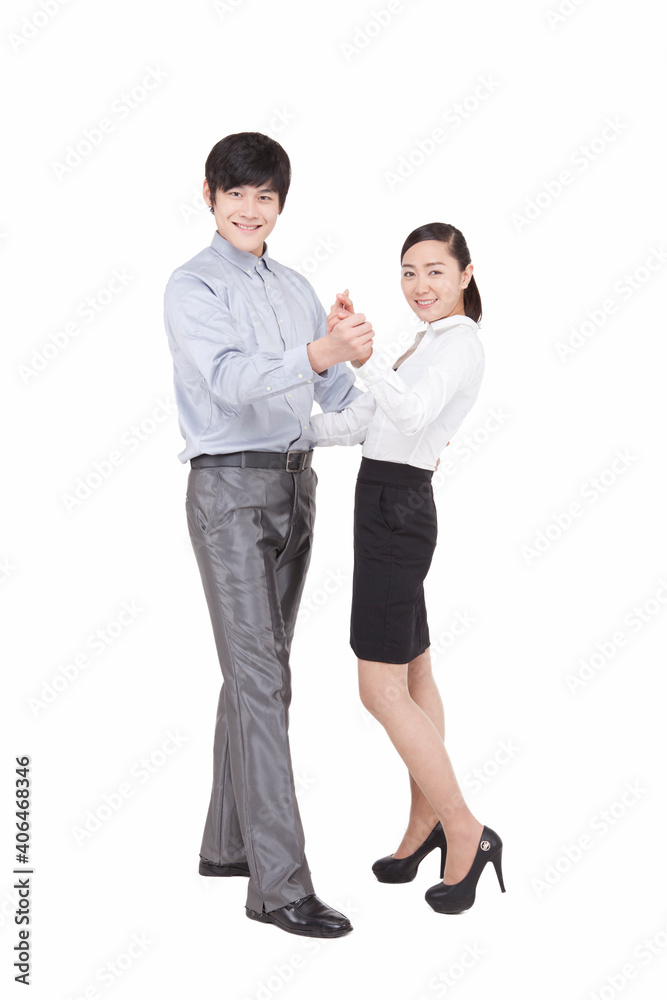 Portrait of business man and business woman dancing