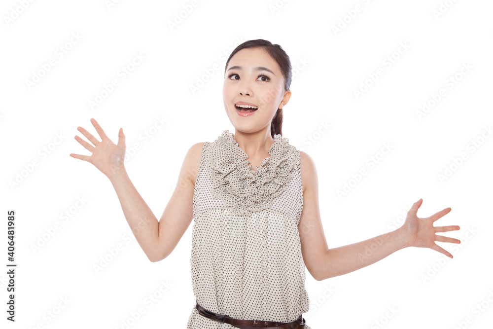 Young woman standing with arms outstretched surprised