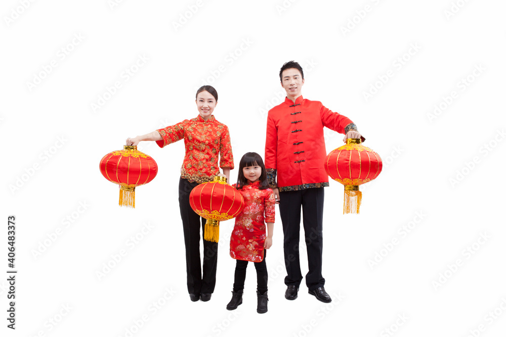 Portrait of family holding red lanterns in Tang suits