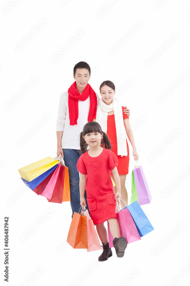 Portrait of daughter holding shopping bags parents holding shopping 