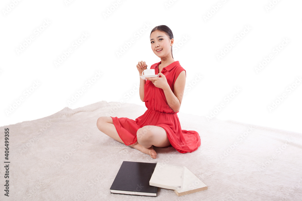 Young woman having cup of coffee sitting 