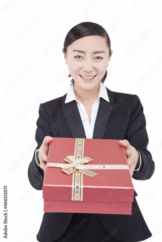 A young Business womman holding gift box