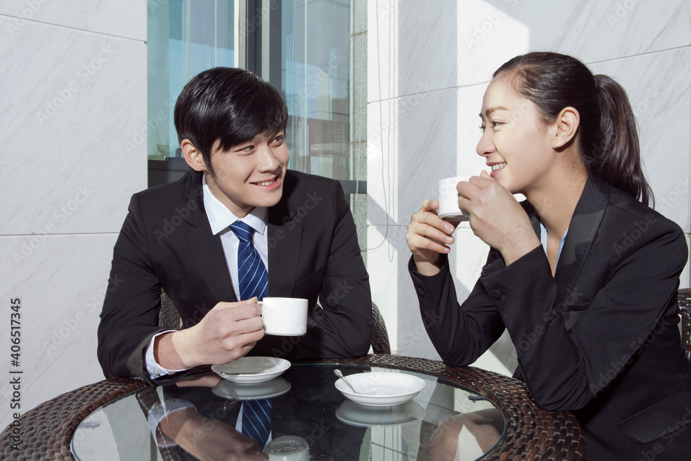 Business man and business woman discussing in office