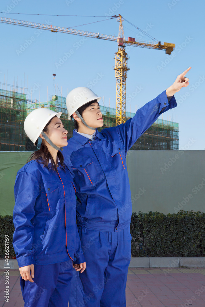 The Young Engineers working at construction field 