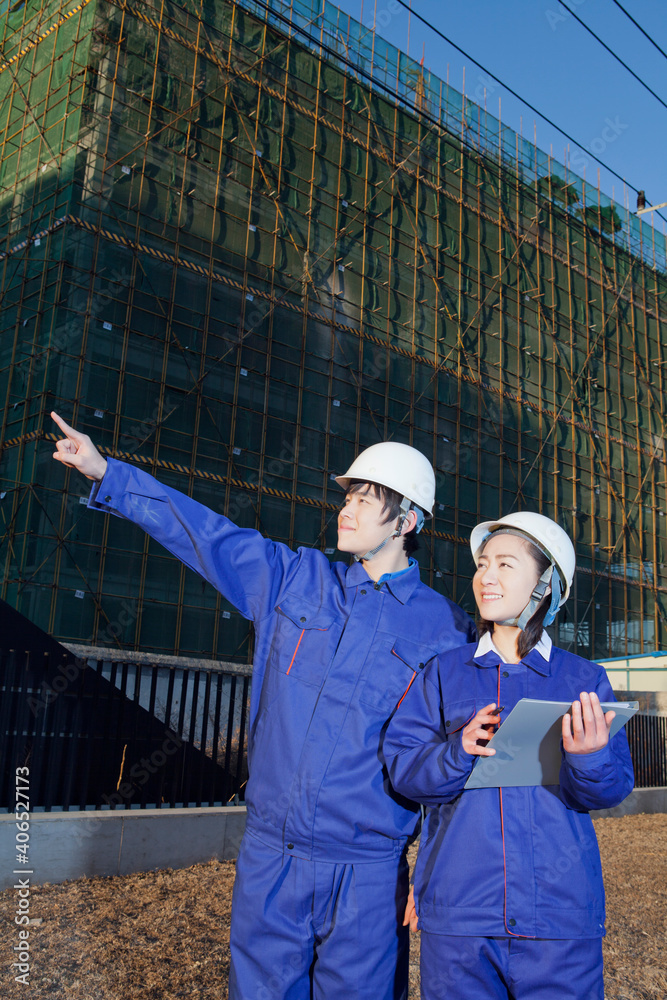 The Young Engineers working at construction field 