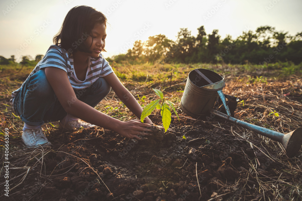 children planting tree in garden. concept eco earth day