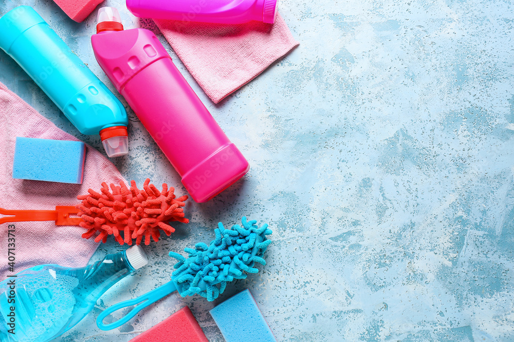 Set of cleaning supplies on color background