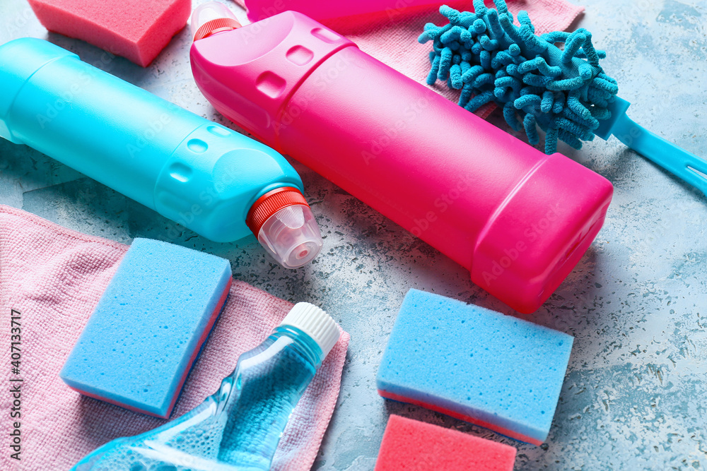 Set of cleaning supplies on color background