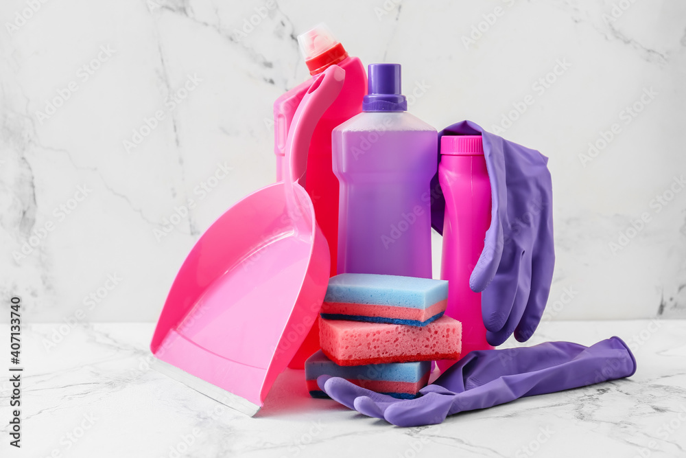 Set of cleaning supplies on light background