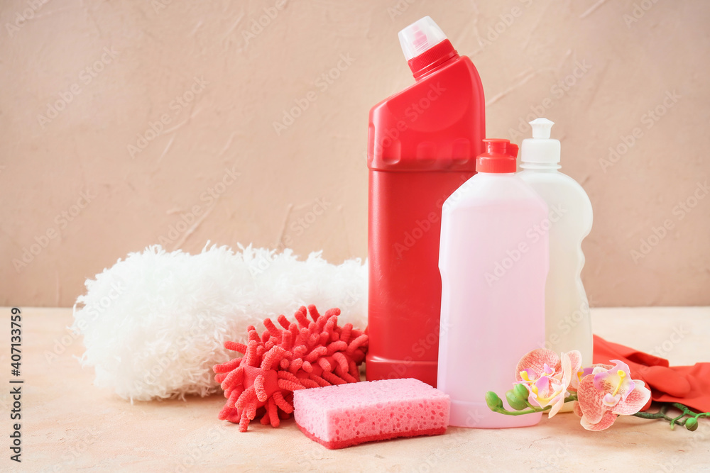 Set of cleaning supplies on color background