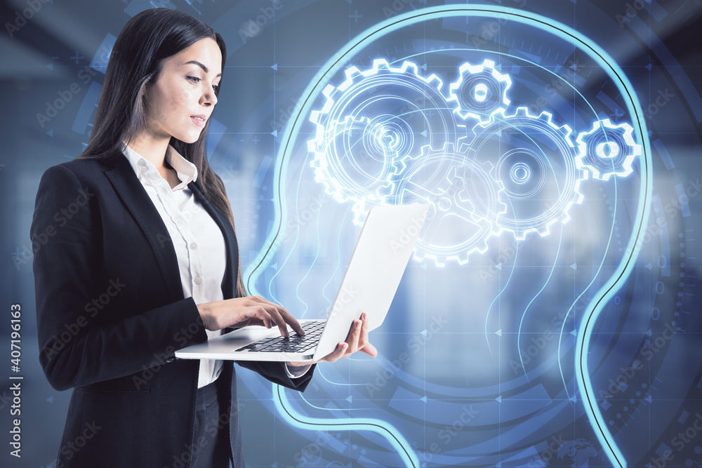 Woman working with laptop on a virtual gears and human head sketch, artificial intelligence and mach