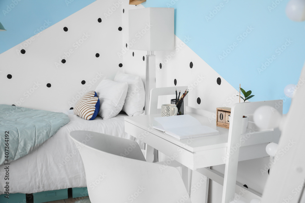 Interior of modern childrens room with stylish table