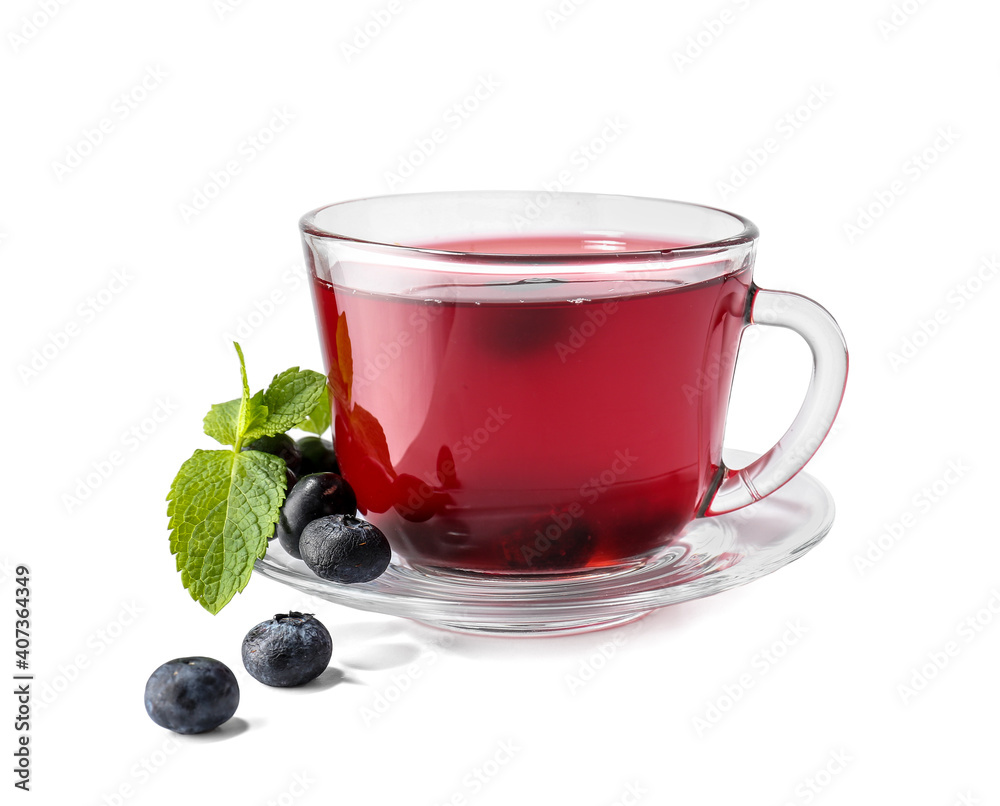 Cup of hot tea with blueberry and mint on white background