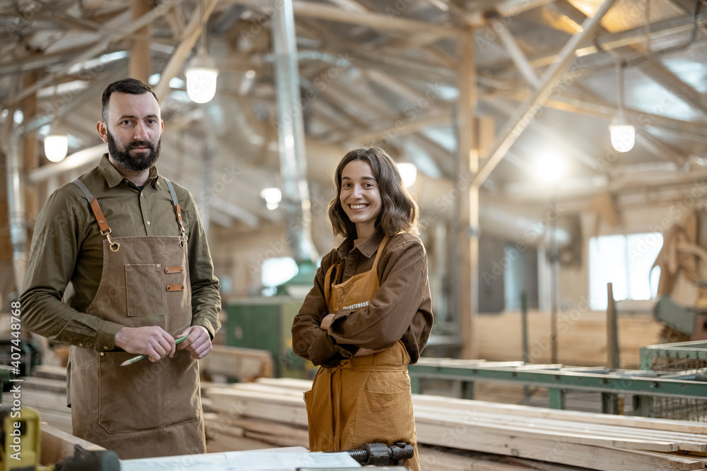 Cheerful carpentry workers portrait looking at camera