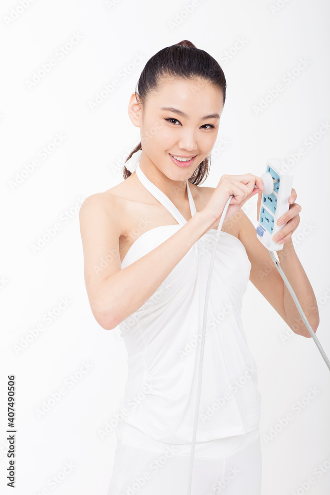 Young woman holding a socket