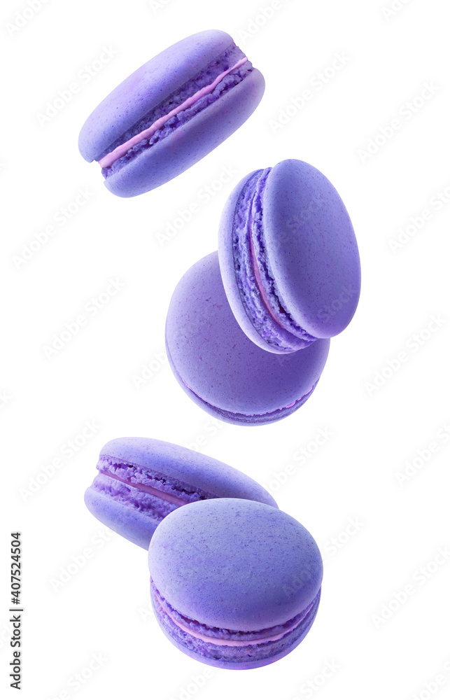 Isolated blue macaroons. Five blueberry or blackberry macaroons falling down over white background