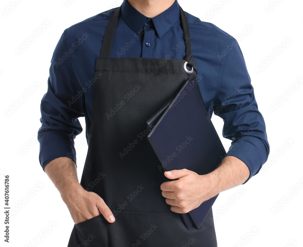 Young waiter holding menu on white background