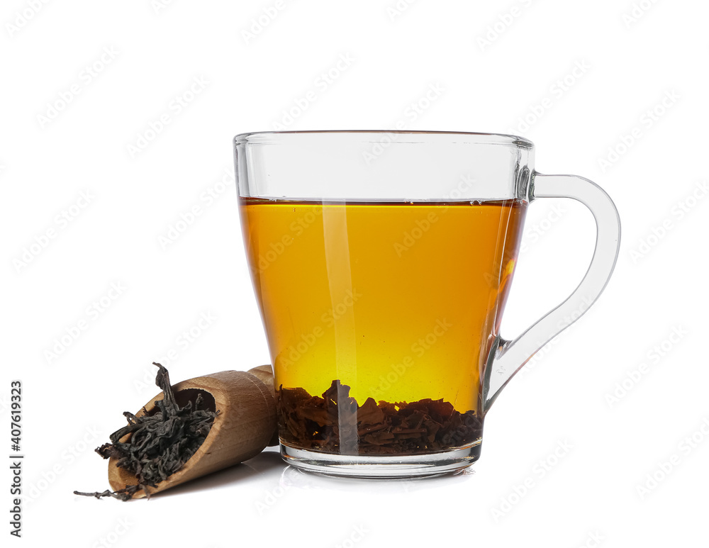 Glass cup of hot black tea on white background