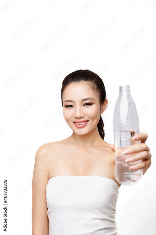 Young woman holding a bottle of water