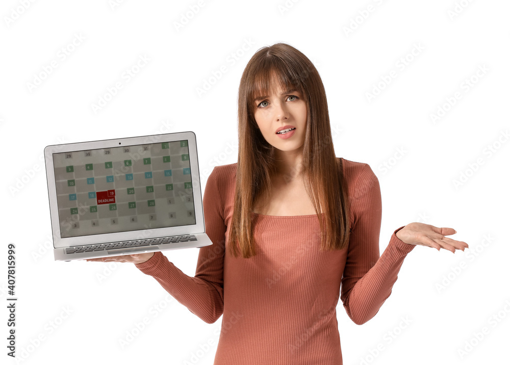 Stressed young woman with laptop on white background. Concept of deadline