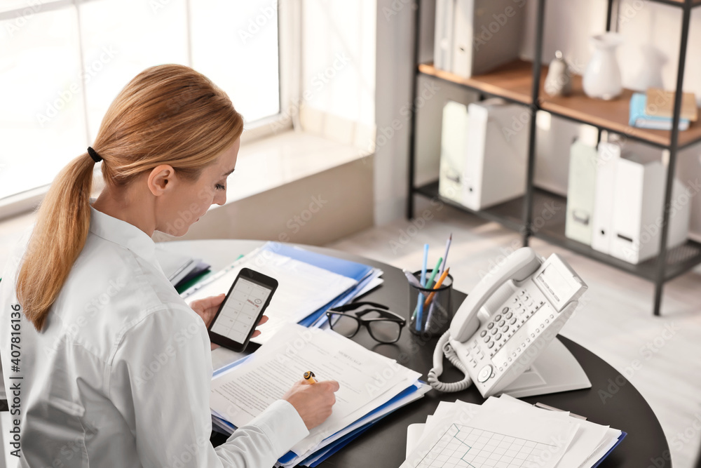 Woman trying to meet deadline in office