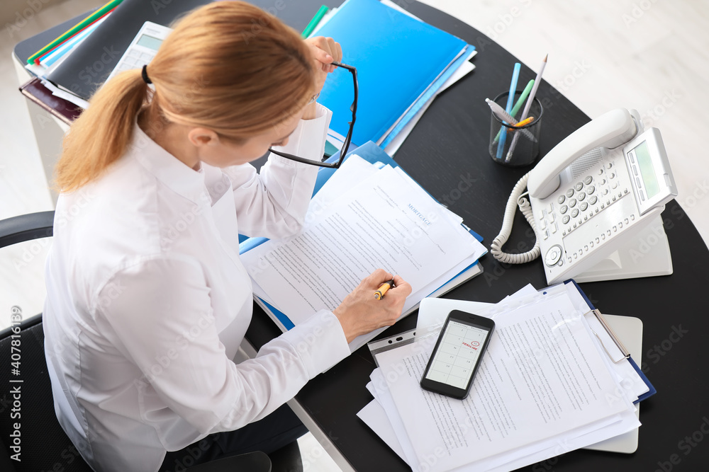 Woman trying to meet deadline in office