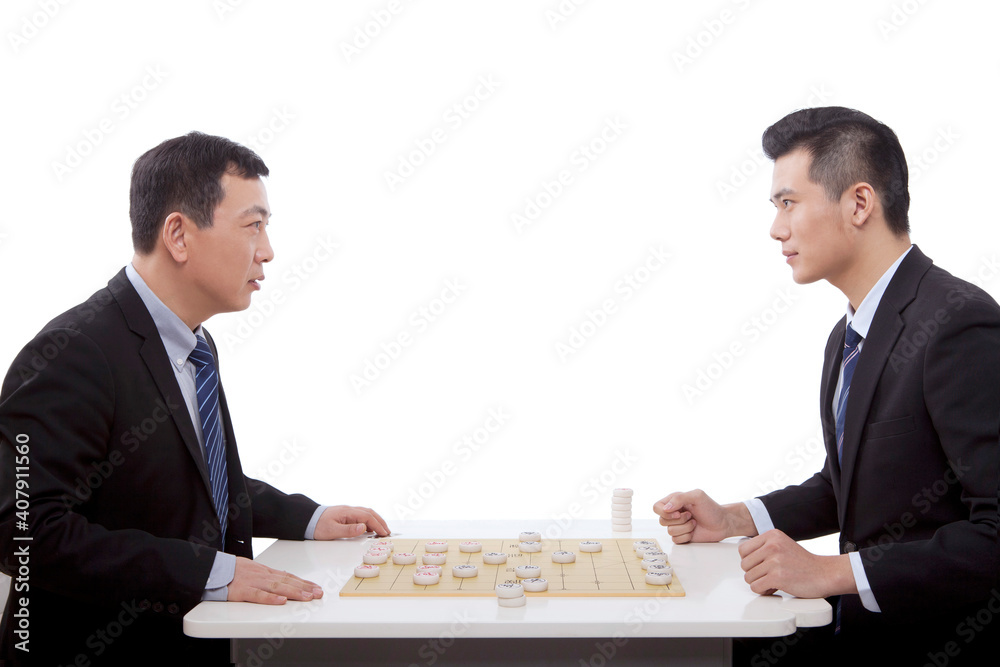 Two business men playing Chinese chess