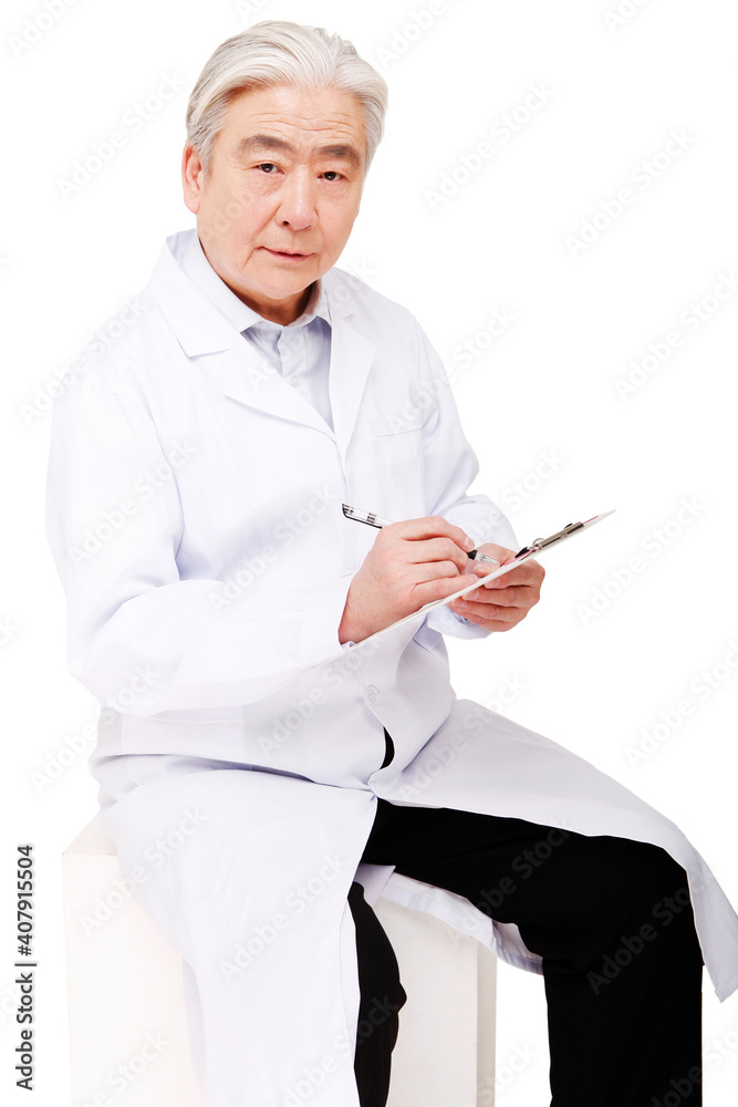 Oriental male doctor holding a writing board