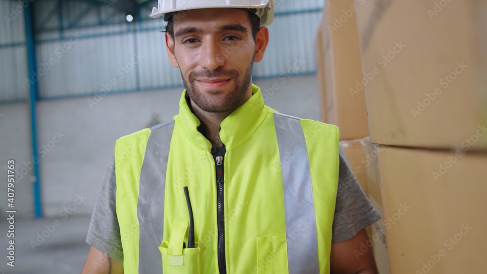 Professional industry worker close up portrait in the factory or warehouse . Production line operato