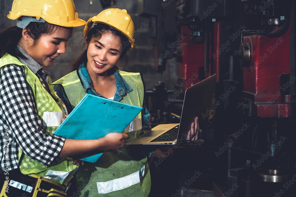 Factory job workers working and discussing manufacturing plan in the factory . Industry and engineer