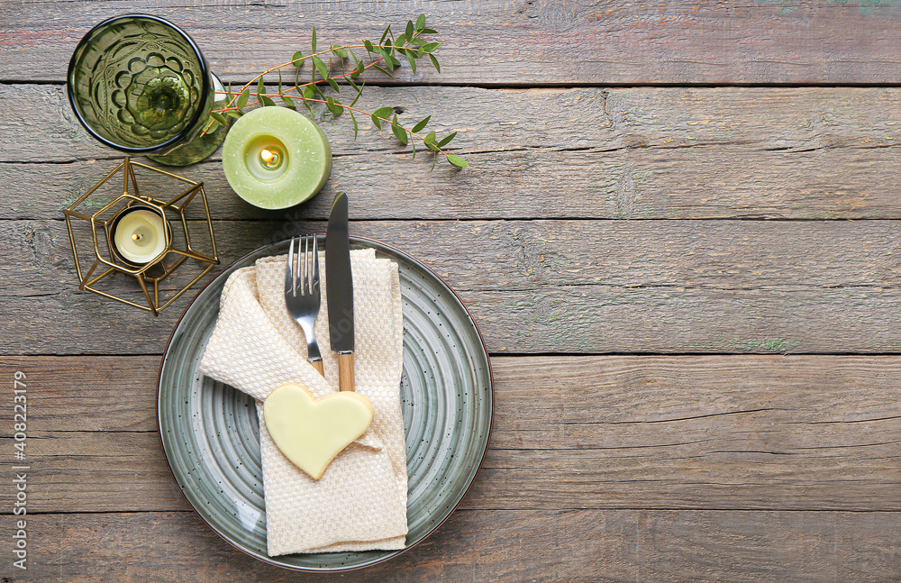 Festive table setting for Valentines Day celebration on wooden background