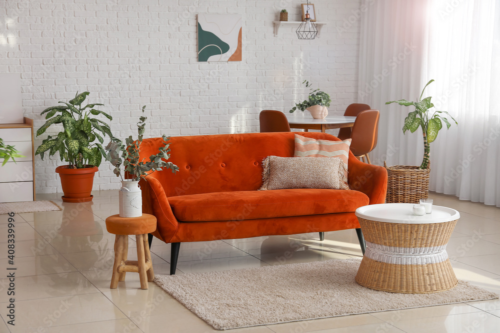 Interior of living room with sofa and dining table