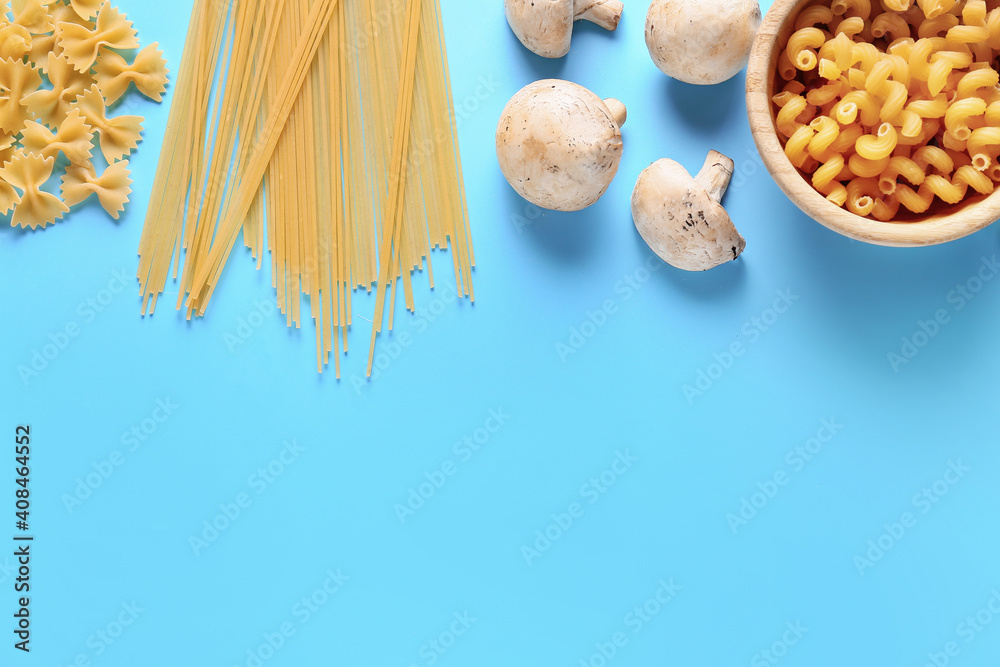 Assortment of dry pasta on color background