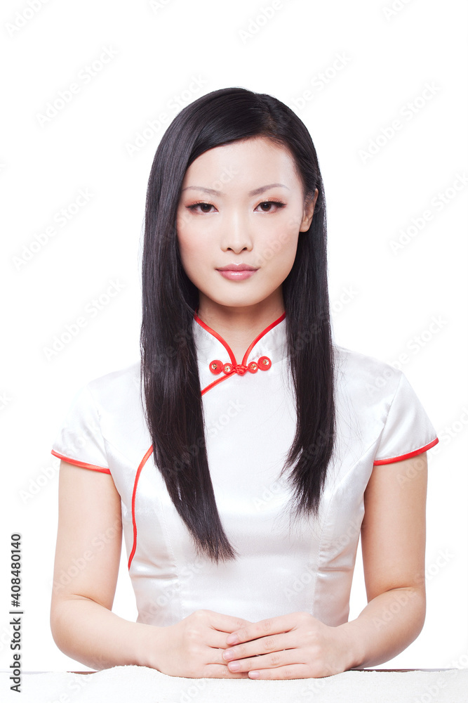 Wearing cheongsam Oriental young woman closeup