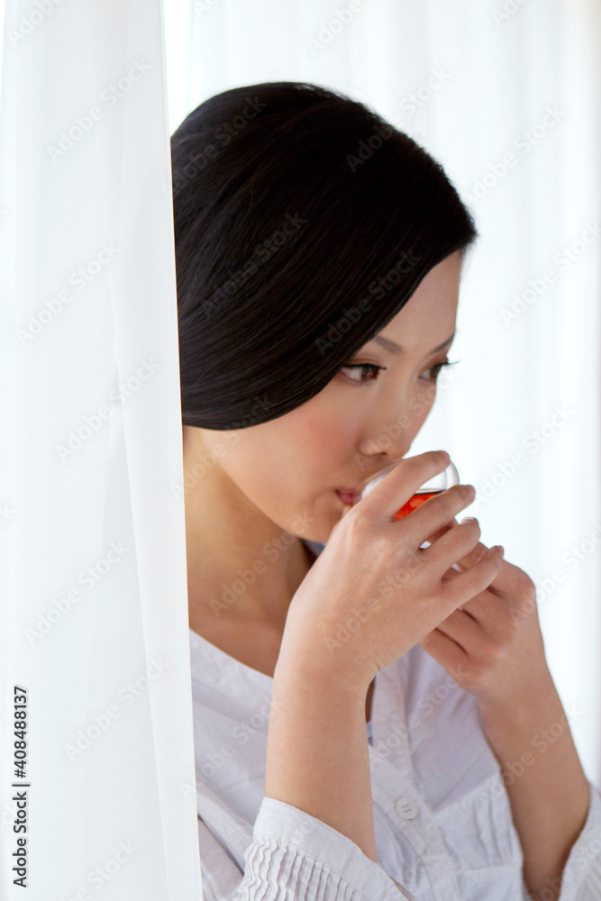 Oriental Tea closeup of young woman