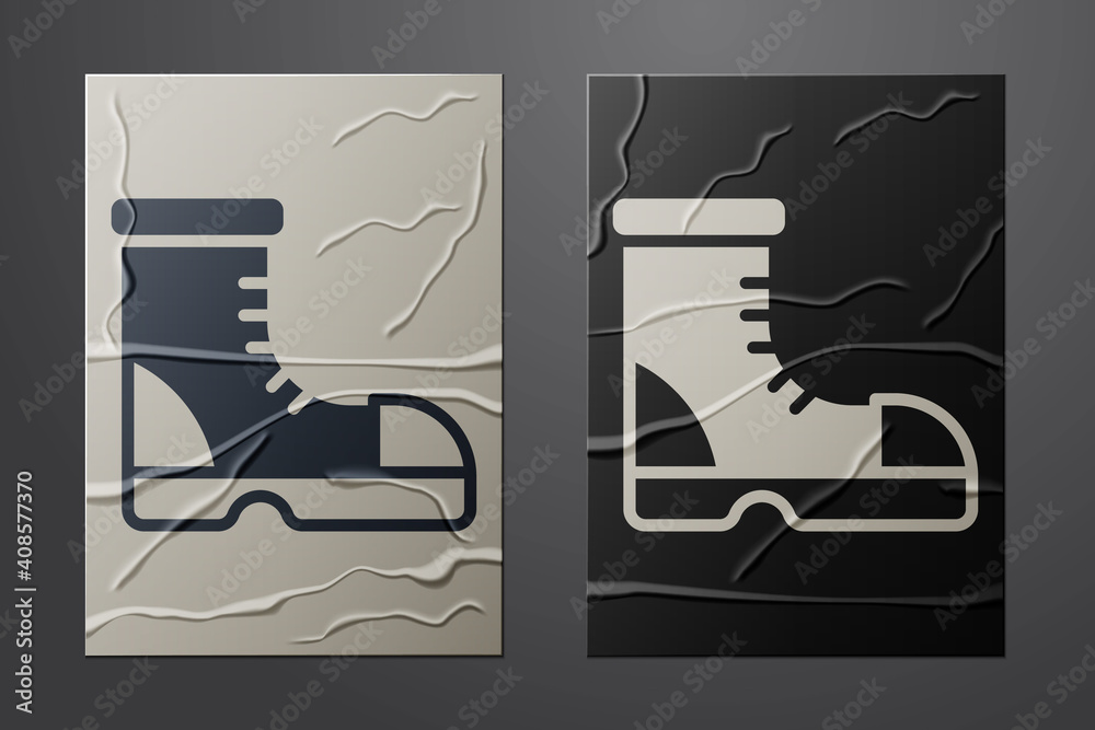 White Hunter boots icon isolated on crumpled paper background. Paper art style. Vector.