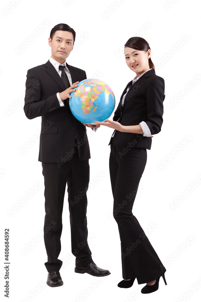 Business people holding a globe