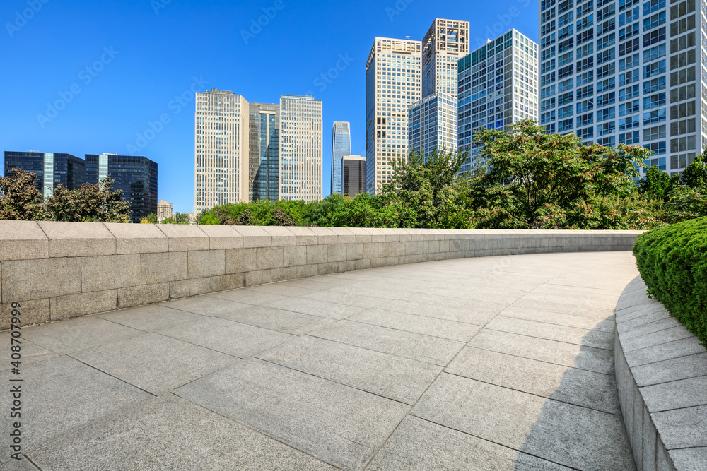 Empty square floor and modern city commercial buildings in Beijing,China.