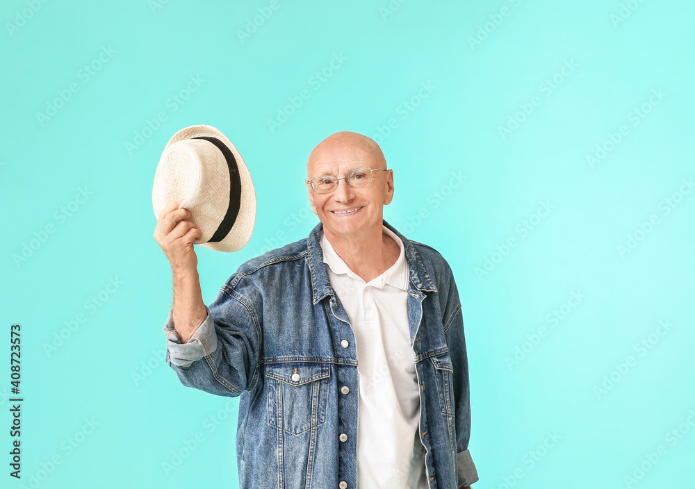 Portrait of senior man on color background