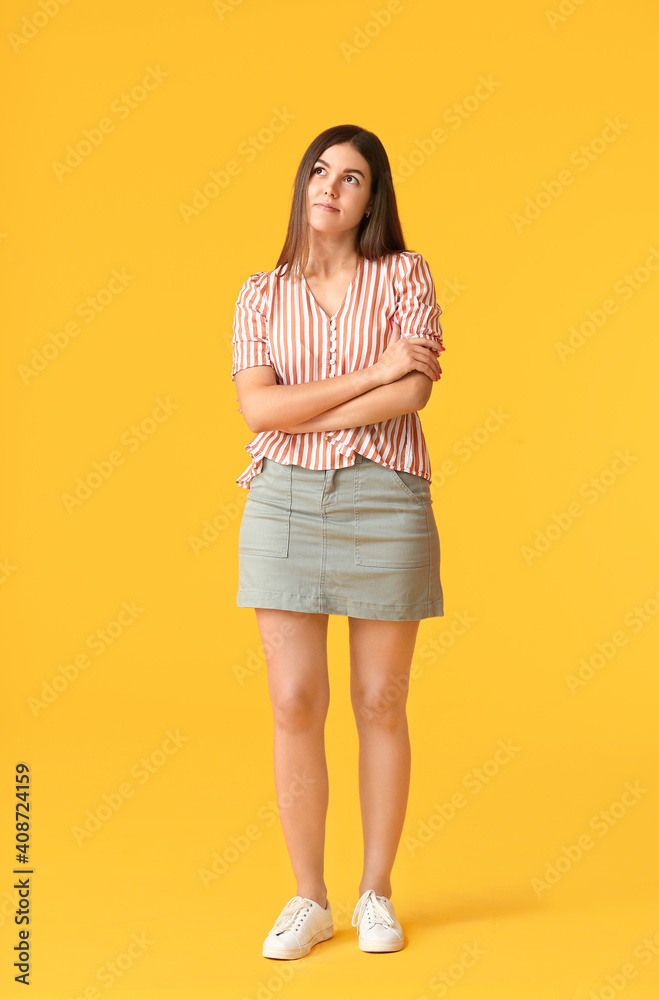 Portrait of beautiful young woman on color background