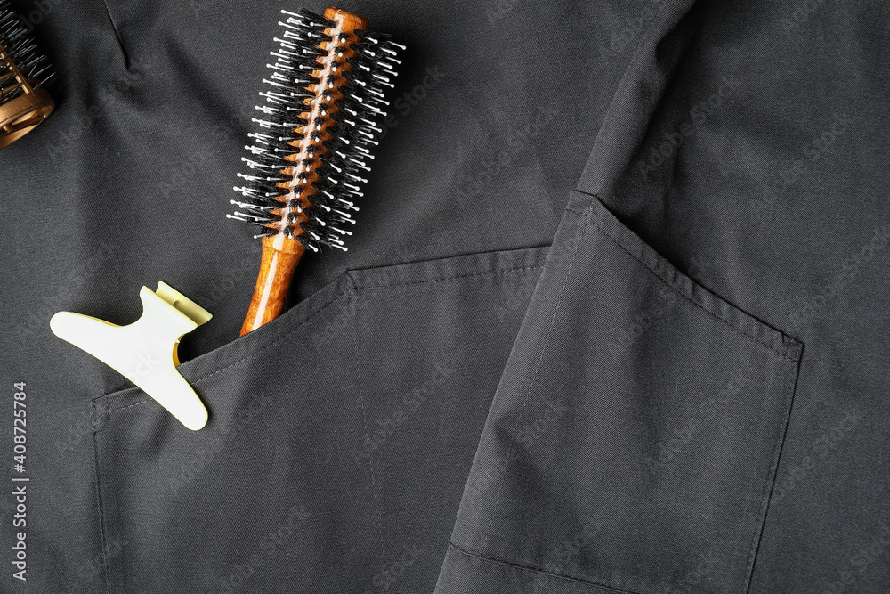 Hair clip, brush and apron as background