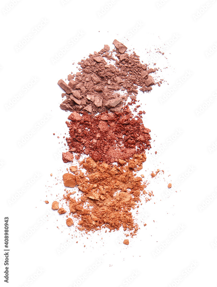 Different crushed eyeshadows on white background