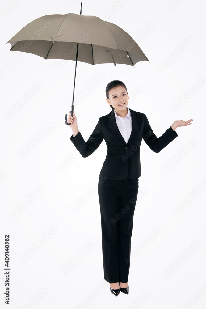 Oriental fashion business woman holding an umbrella