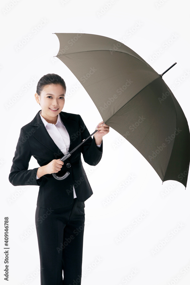 Oriental fashion business woman holding an umbrella