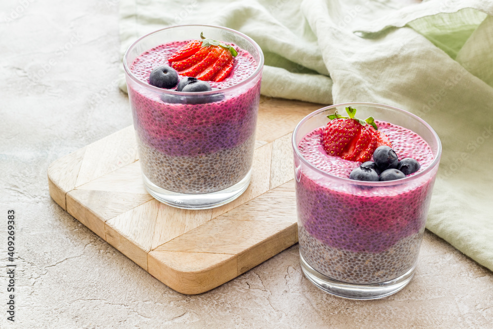 Homemade yogurt chia seeds pudding with strawberries in glasses