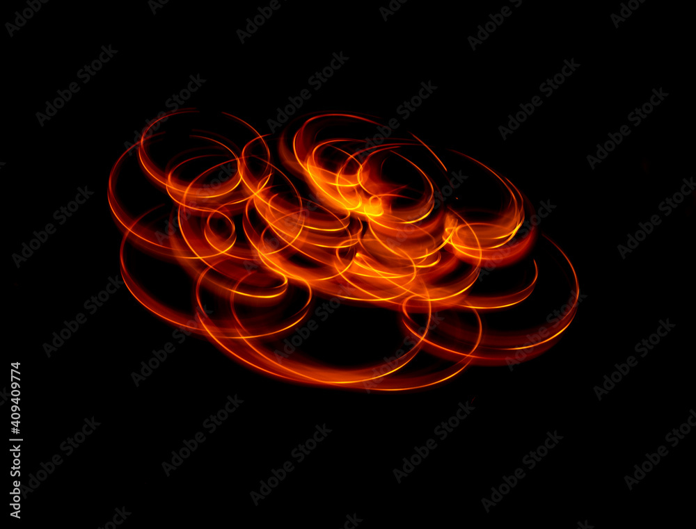 Light wave trail path, vibrant neon gold color in abstract swirls on a black background