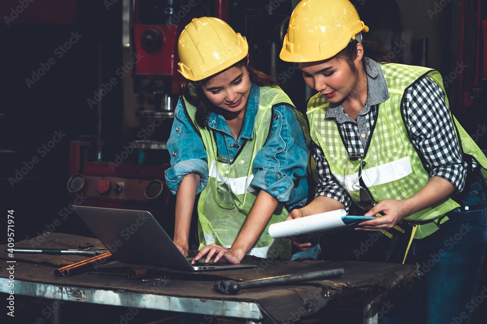 Factory job workers working and discussing manufacturing plan in the factory . Industry and engineer